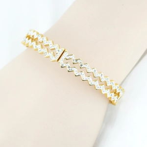 Polished gold zigzag bangle with sparkling crystals for a modern luxury look