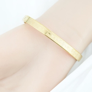 Golden titanium steel bracelet with engraved Sanskrit Mantra Buddhist script for women