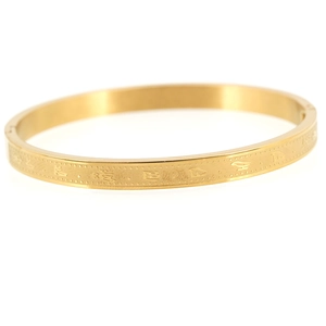 Golden titanium steel bangle with Buddhist Sanskrit engraving and hinged clasp closure
