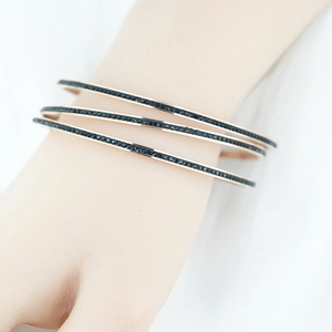 Ensemble de trois bracelets joncs or rose sertis de strass noirs étincelants