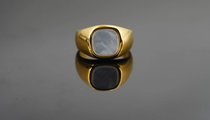 Close-up of 18K gold-plated signet ring with a cushion-cut blue-grey mother of pearl inlay