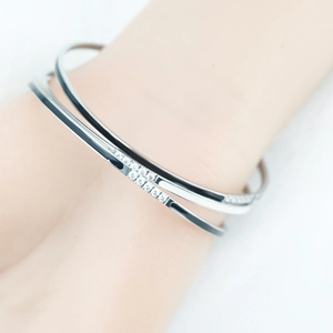 Dual-layer titanium steel cuff bracelet with black white enamel and pavé crystals