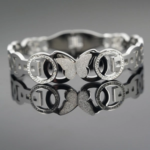 Polished titanium steel butterfly bangle with sparkling crystal inlay on black mirror