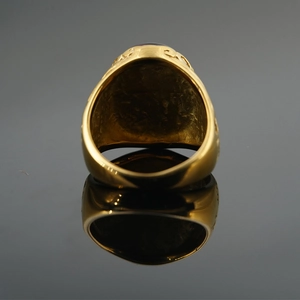 Gold plated titanium steel signet ring with oval purple gemstone and carved patterns