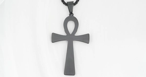 Macro shot of matte black stainless steel Ankh cross pendant with box chain detail