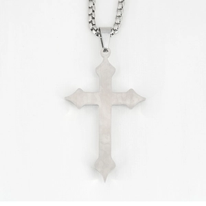 Gothic stainless steel cross pendant on box chain necklace for men shown on white textile