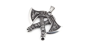 Close-up of double battle axe pendant with Nordic wolf engraving in retro silver steel