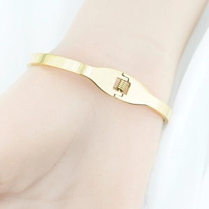 Elegant gold plated stainless steel butterfly bangle with a secure spring hinge closure