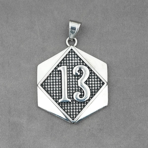 Hip hop silver hexagon pendant necklace featuring embossed number 13 on textured metal