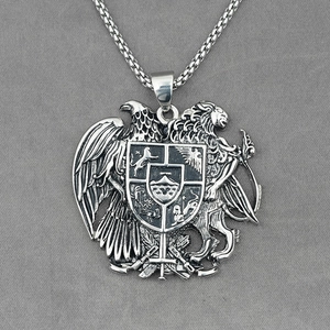 Vintage silver shield necklace with eagle and lion motifs in embossed stainless steel