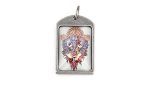 Detailed view of vintage Ganesha pendant in antique silver frame on white background