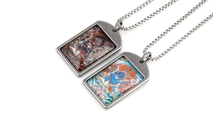Macro view of vintage silver zodiac Thangka pendants with detailed religious artwork