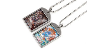 Close-up of vintage titanium steel zodiac pendants with colorful Thangka art details