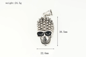 Macro view of punk skull pendant showing dimensions 38.5mm by 22.6mm and 24.5g weight