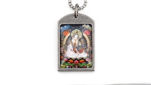 Macro shot of retro stainless steel pendant featuring a colorful Thangka zodiac artwork