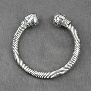 Punk style silver cable wire open bangle with detailed skull heads for men