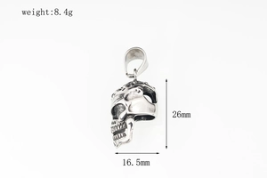 Detail view of punk skull pendant with dimensions 26mm x 16.5mm weighing 8.4g