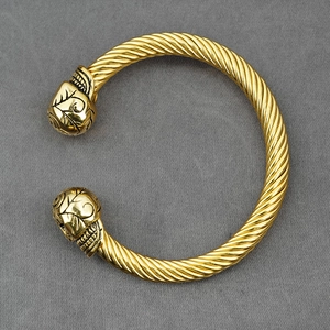 Punk style golden stainless steel twisted cable cuff bracelet with engraved floral end caps