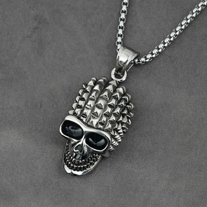 Punk style skull pendant necklace with rivet details in silver stainless steel