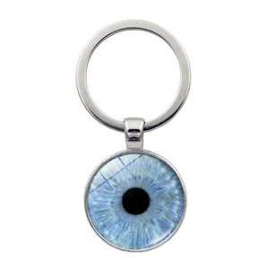 Detailed view of silver metal keychain with realistic blue evil eye glass dome pendant