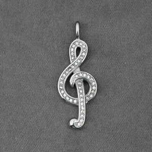 Sparkling silver treble clef music pendant with crystal accents for jewelry making