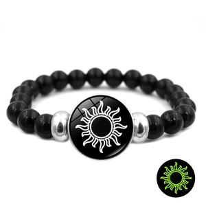 Luminous Sun and Moon beaded couple bracelet with glowing circular glass pendant