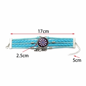 Detail view of sky blue multilayer woven bracelet with Love charm and dartboard pendant