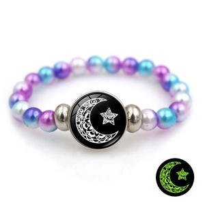 Luminous Sun Moon beaded bracelet with glowing charm and iridescent purple and blue beads