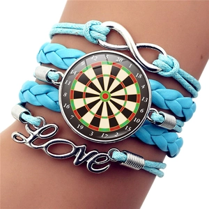 Close-up of multi-layer blue braided bracelet featuring dartboard and Love infinity charms