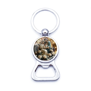 Silver metal keychain bottle opener featuring a religious Holy Family glass cabochon charm