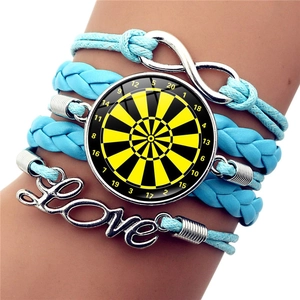 Detail of multi-layer woven bracelet with dartboard glass cabochon and love charm