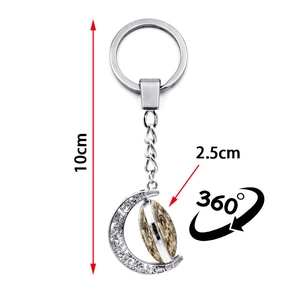 Rotating double-sided moon keychain with a 360-degree spinning pendant in silver alloy