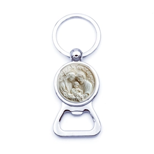 Detailed view of silver bottle opener keychain featuring a Holy Family relief ornament