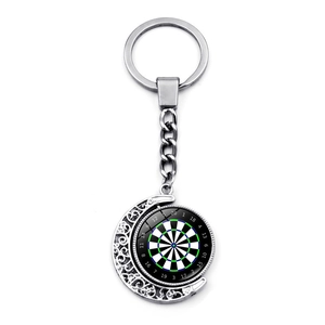 Macro shot of double-sided rotating moon keychain with dartboard scoring pattern