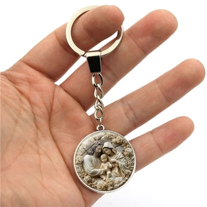 Religious Holy Family keychain with round silver alloy pendant and rose relief details
