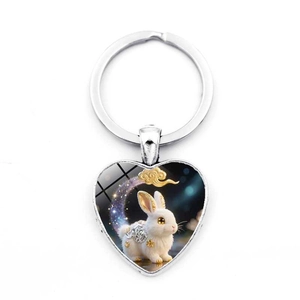 Silver heart-shaped keychain featuring a Chinese zodiac white rabbit and cloud illustration