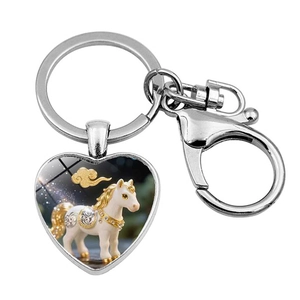 Detail of heart-shaped metal keychain with white horse illustration and lobster clasp