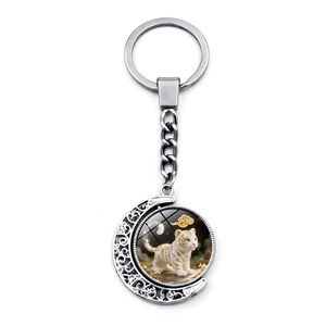 Rotating zodiac white tiger moon keychain in silver metal with creative filigree design