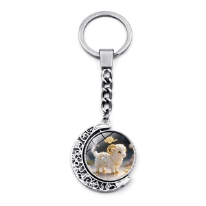 Detail of silver moon keychain with a rotating double-sided cute sheep glass pendant