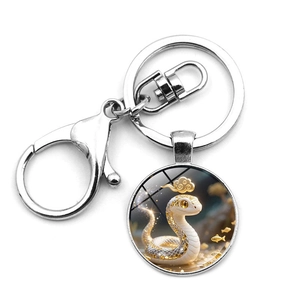 Detail of silver zodiac snake keychain with lobster clasp and round glass pendant