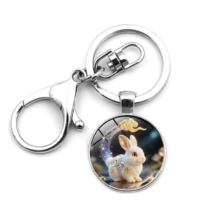 Detailed close-up of a silver keychain featuring a rabbit pendant and lobster clasp