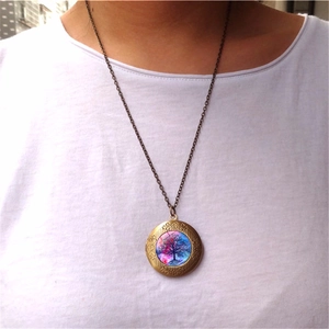 Vintage Tree of Life locket necklace with bronze glass pendant on a white shirt