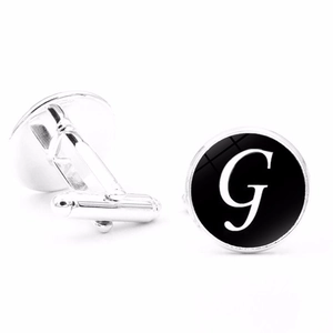 Classic silver-tone men's cufflinks featuring a black round face with white letter G