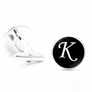 Detailed view of silver-plated cufflinks with black letter K design and T-bar fastening