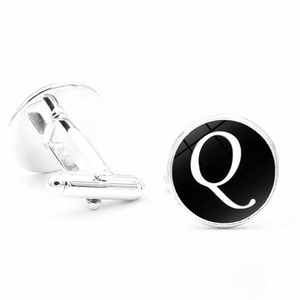 Detailed view of silver letter Q cufflinks with polished black dial and swivel post back