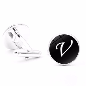 Detail of silver round cufflinks with black letter V design for French shirts