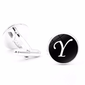 Detailed view of silver cufflinks with black alphabet Y and polished glass dome