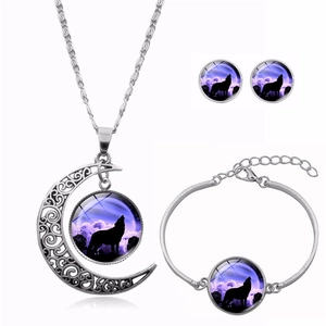 Detailed view of howling wolf moon necklace jewelry set with purple galaxy patterns