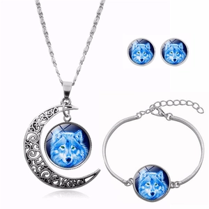 Detail of howling wolf moon necklace set with matching bracelet and stud earrings