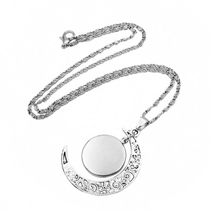Howling wolf moon necklace with silver crescent pendant and vintage filigree details